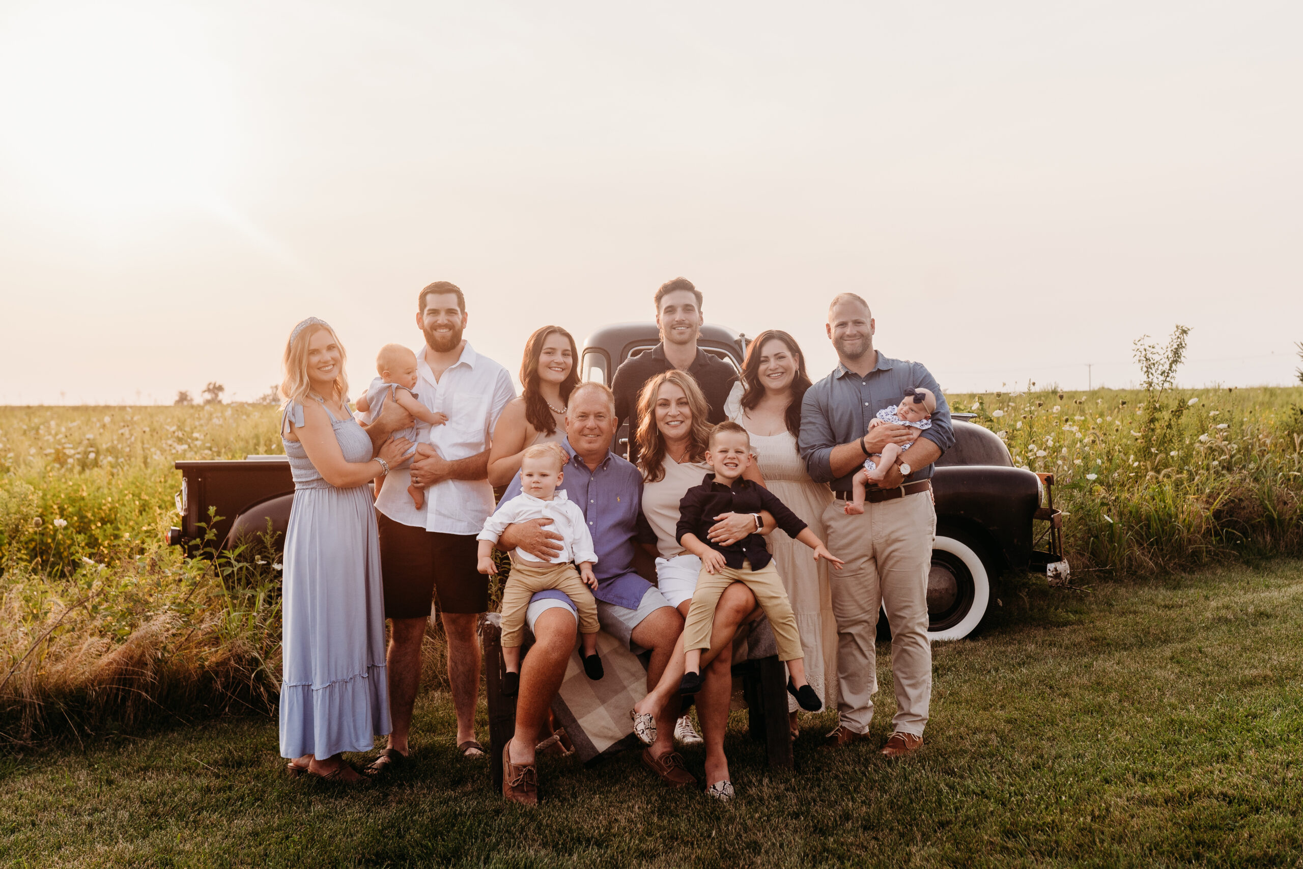 Photo of family in prairie grass field.